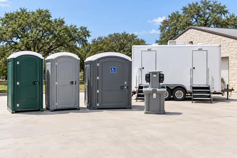 Portable toilets, washing station and trailer lineup